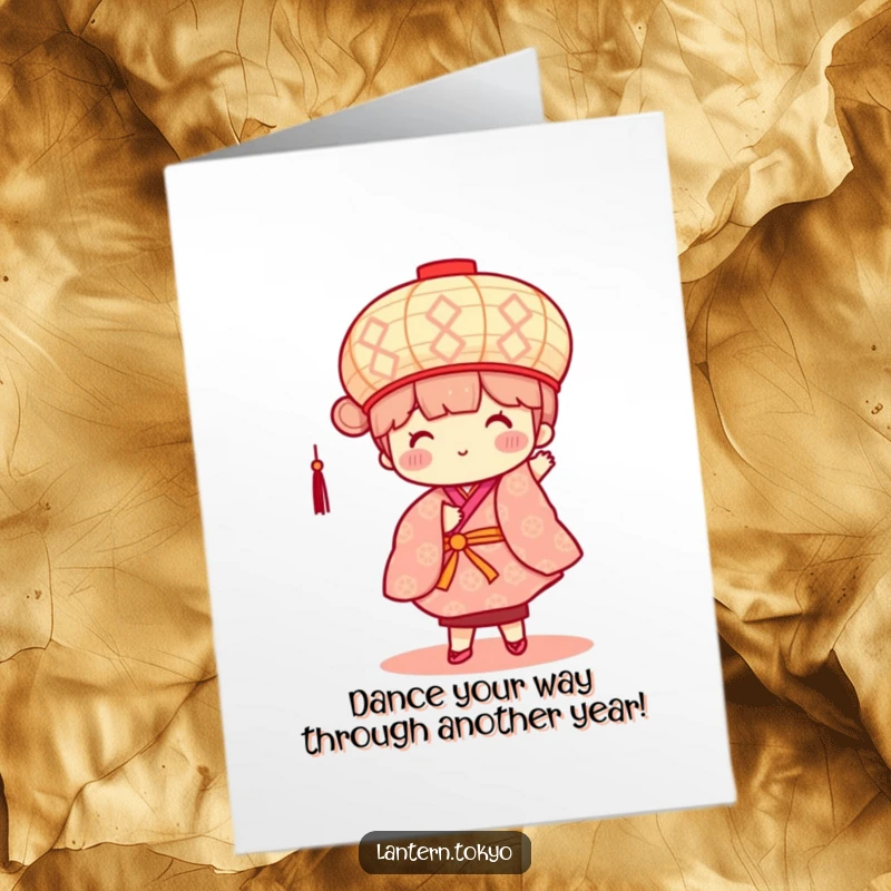 Lively Free Printable Birthday Card: A square, patterned lantern with rosy cheeks happily dances in a colorful kimono.