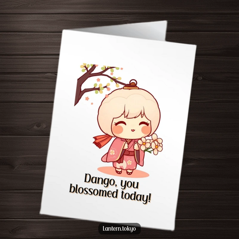 Free Printable Birthday Card: A blushing dango lantern in a kimono offers a delicate flower, conveying sweet birthday wishes.